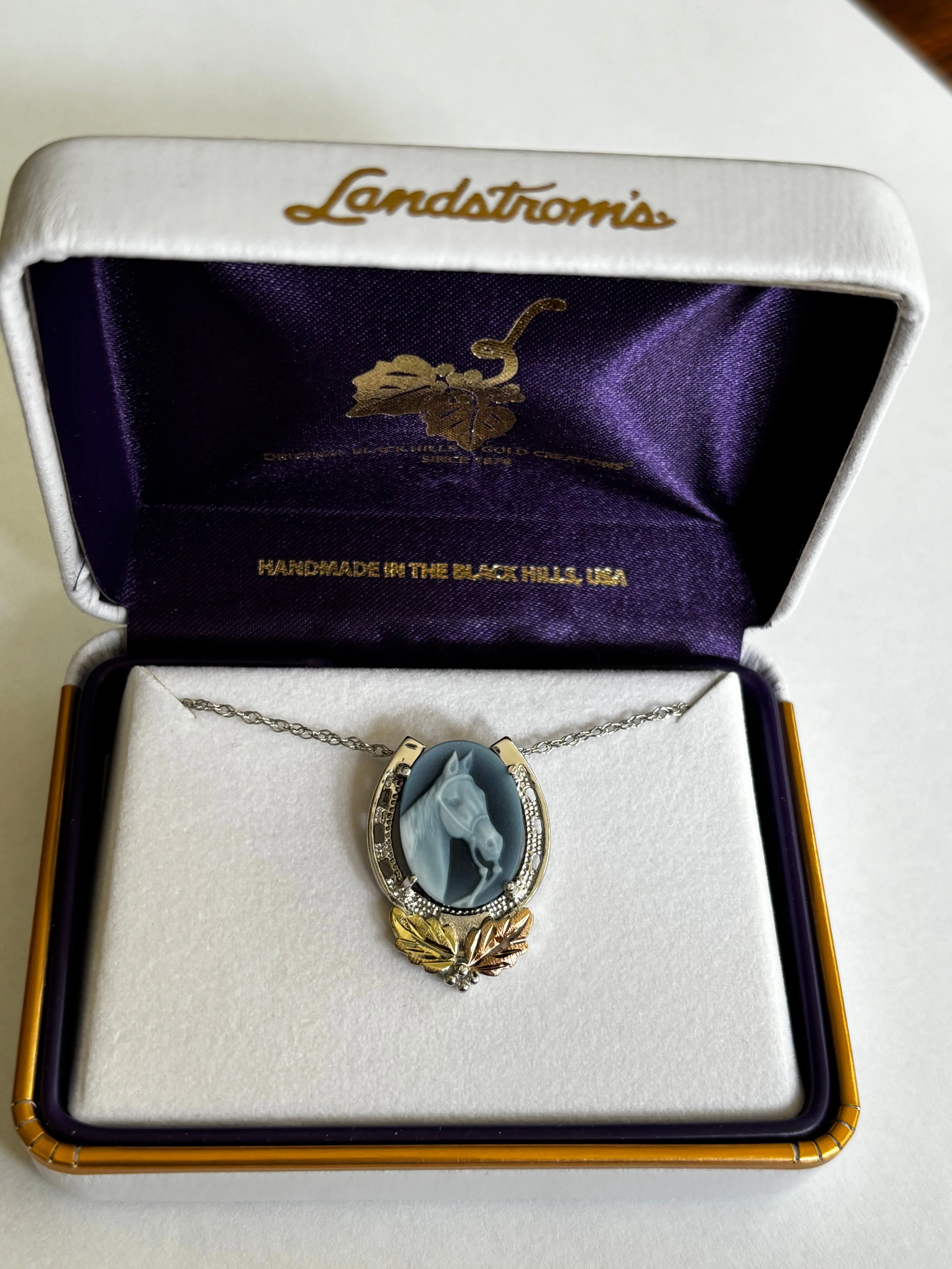 Beautiful Horse Blue Agate Cameo encased in a Landstrom's Black Hills Gold and Silver Horseshoe Pendant