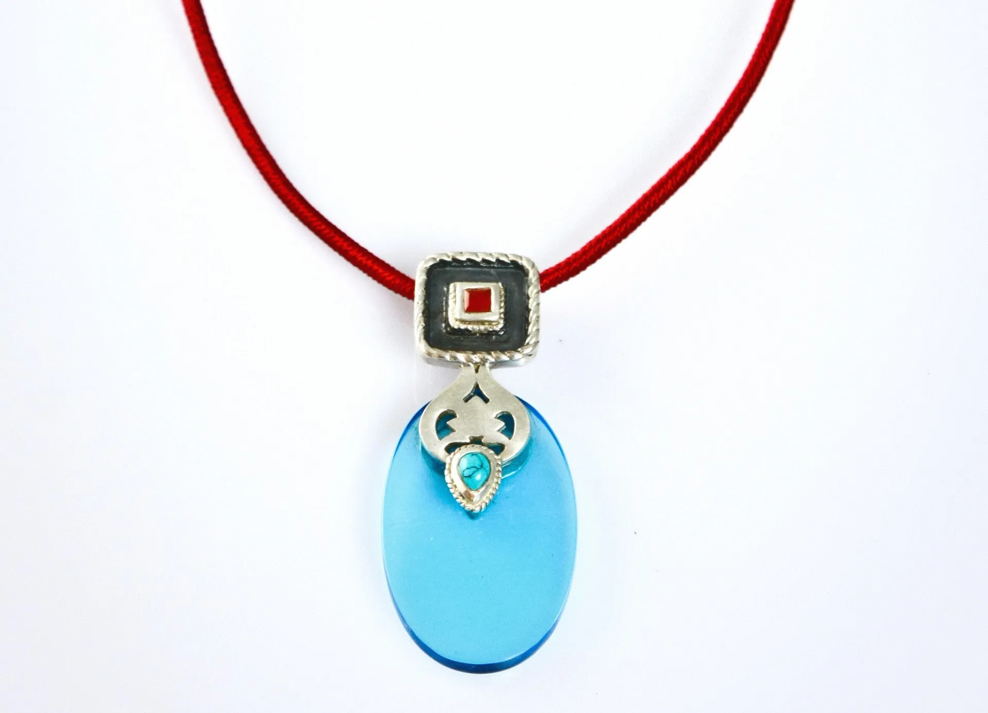 Chic, oval blue glass pendant with silver, turquoise and carnelian detailing