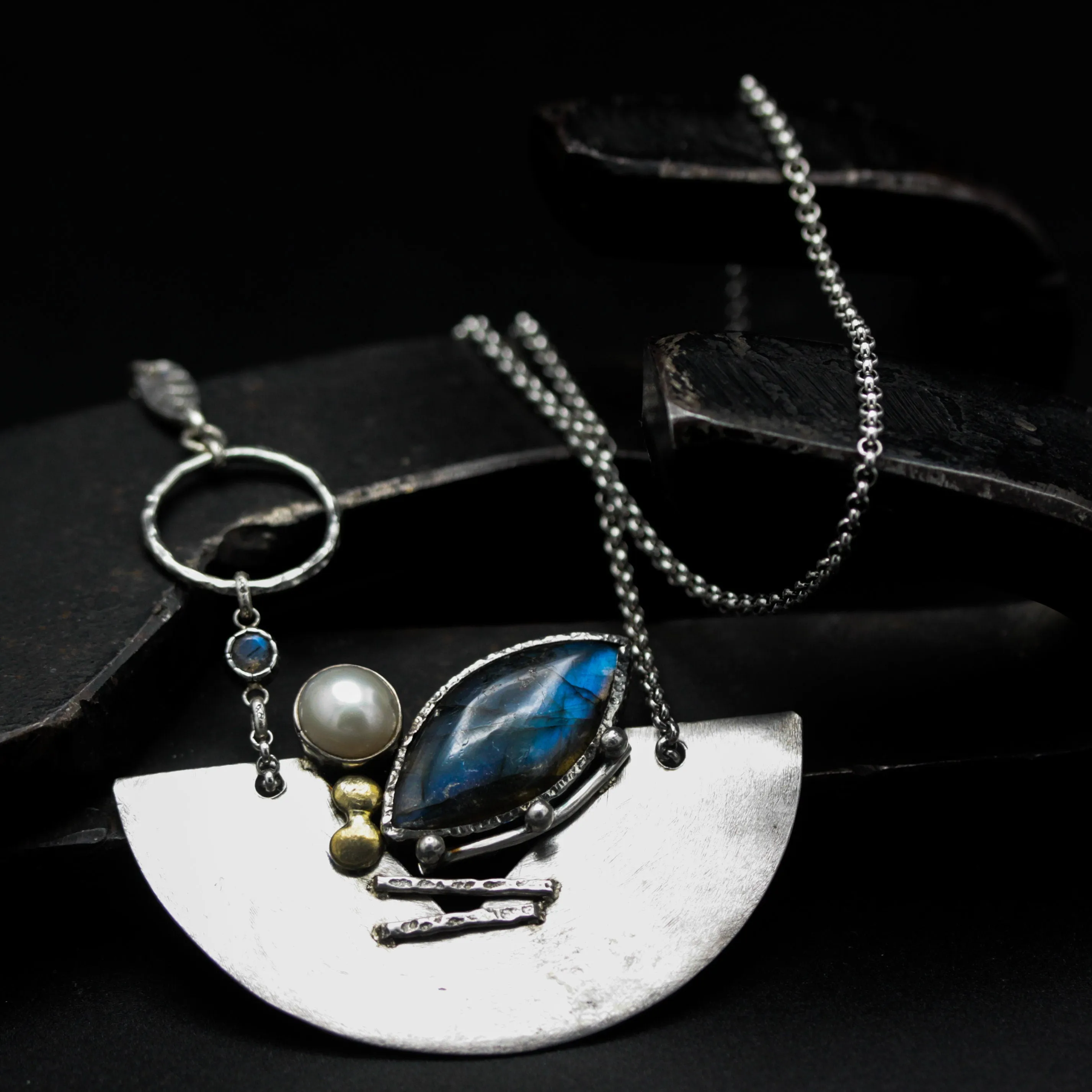 Marquise labradorite pendant necklace in silver bezel setting and freshwater pearls with silver fan shape on silver chain