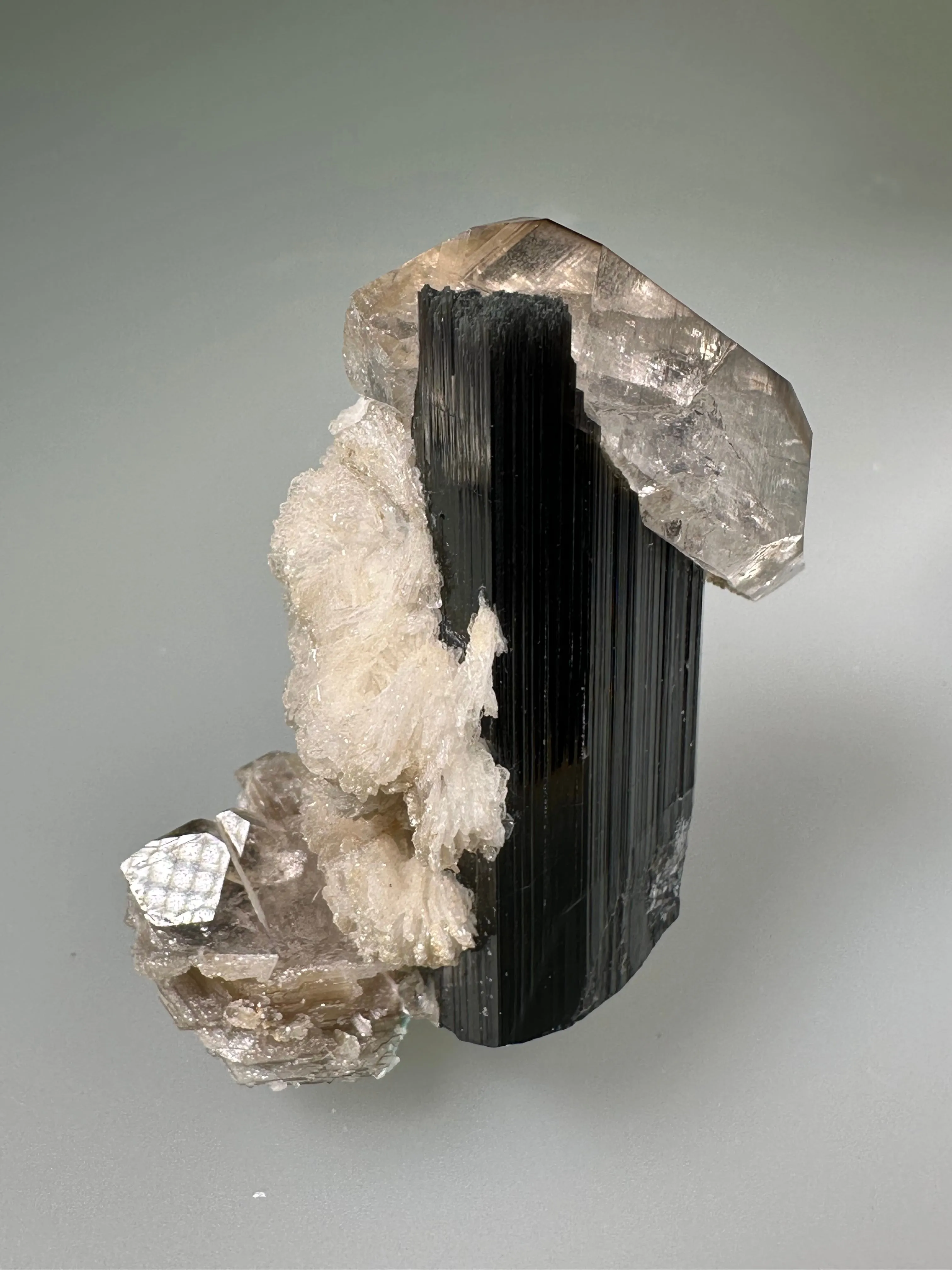 Quartz and Albite on Elbaite, Gilgit, Pakistan, Mined c. 1990s, ex. WIlliam Mickols Collection, Miniature, 2.5 x 4 x 5 cm, $50. Online Oct. 9.