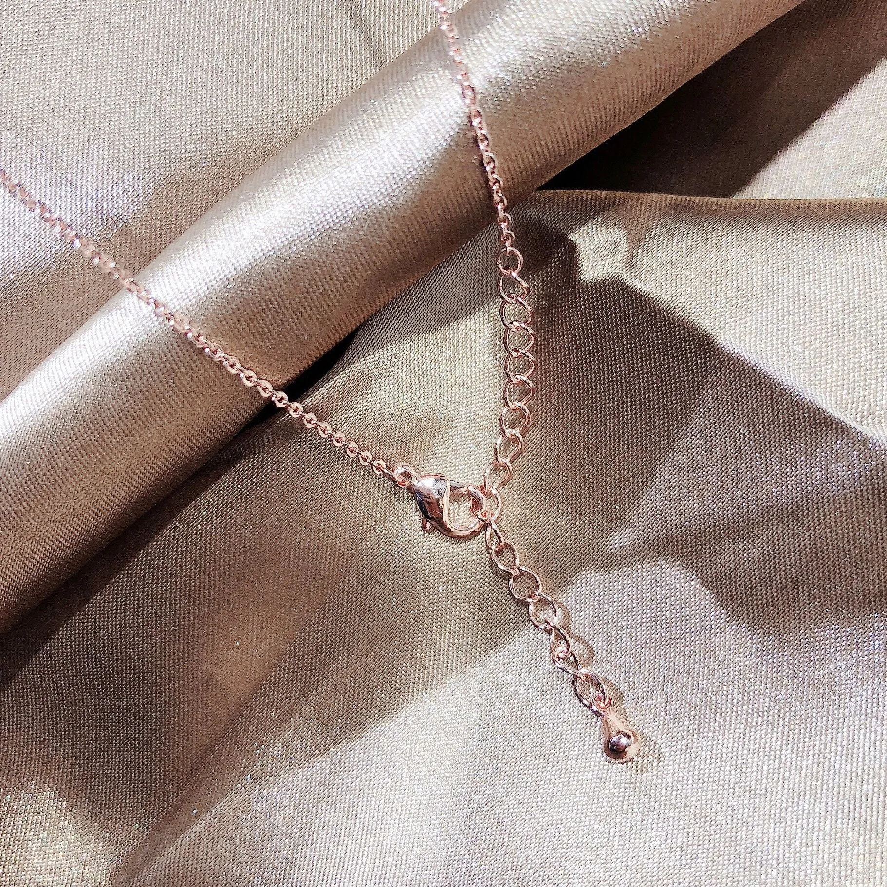 Rosegold Plated Design of Ribbon Pendant
