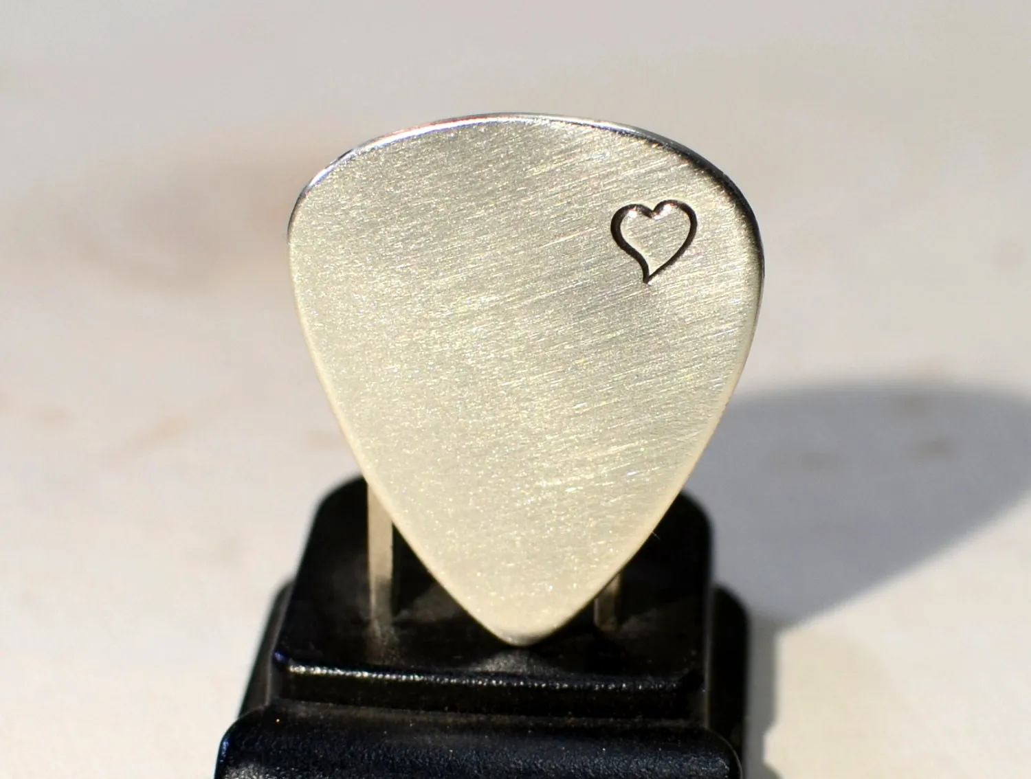 Sterling silver guitar pick with love and a heart