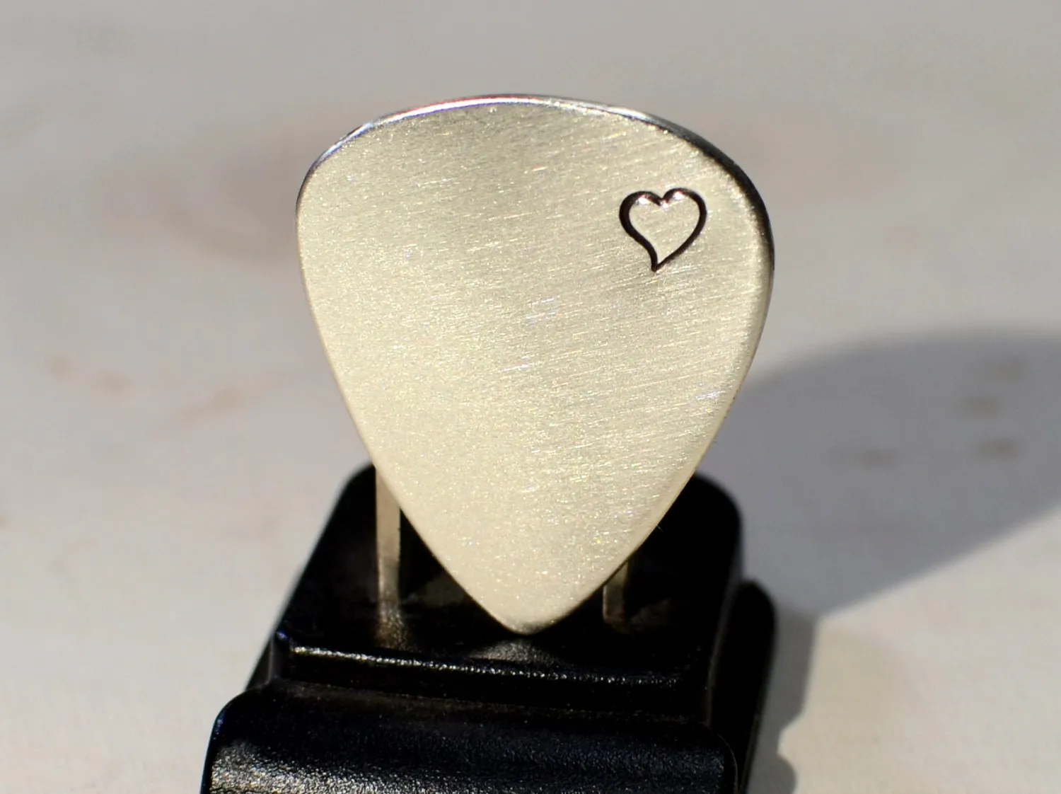Sterling silver guitar pick with love and a heart