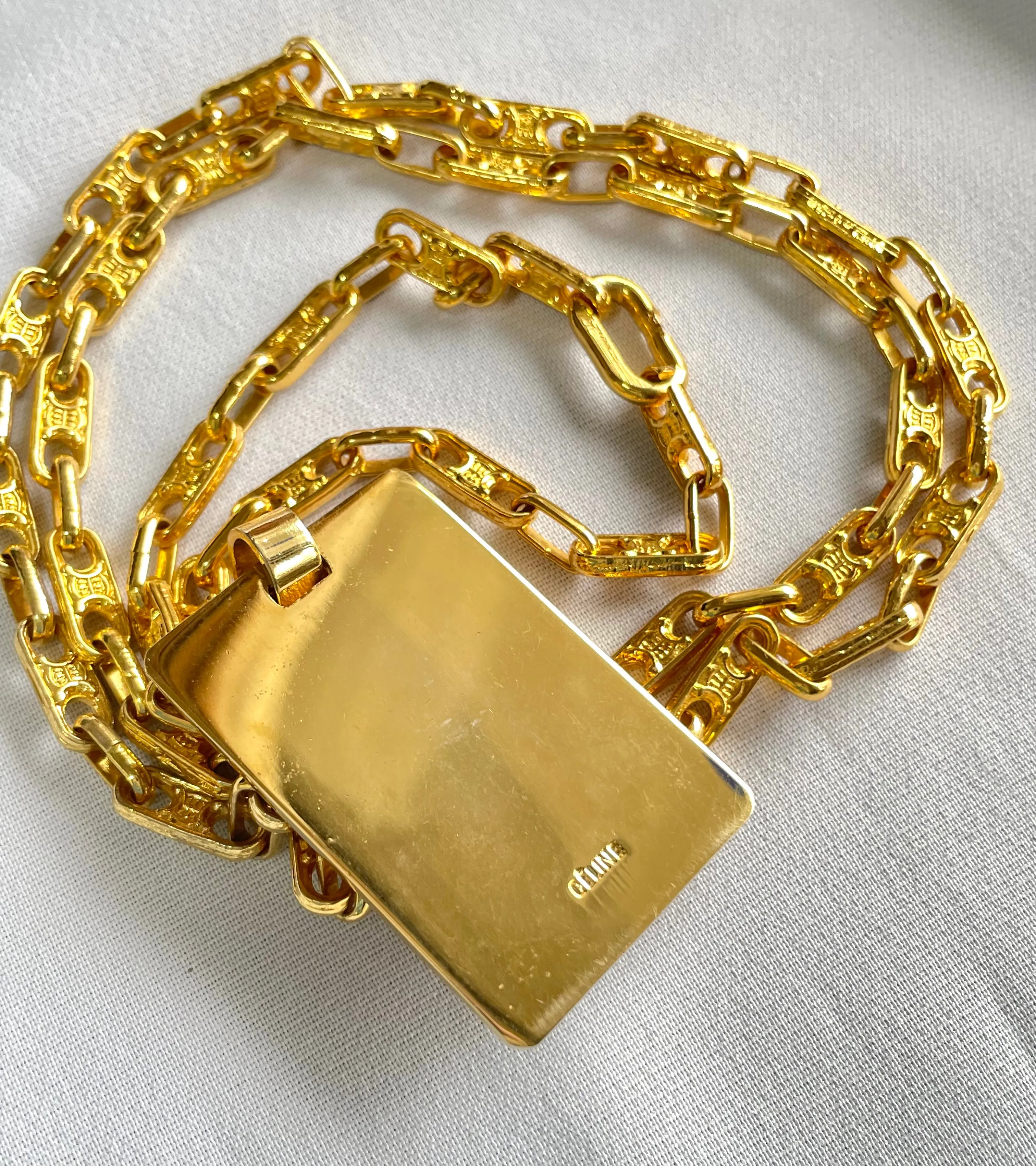 Vintage Celine golden long necklace with blaison macadam charms and square plate with embossed logo and carriage. 041032